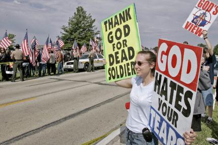 Megan Phelps picketing the funeral of a dead soldier in 2010 (Photo Pickling In His Presence)